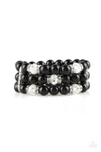 Load image into Gallery viewer, Paparazzi - Undeniably Dapper Black Bracelet - Paparazzi Accessories - Pinched between white rhinestone encrusted frames, white rhinestone encrusted rings, crystal-beads, and shiny black beads are threaded along elastic stretchy bands for a glamorous look.  Sold as one individual bracelet. Paparazzi jewelry and accessories is  lead-free and nickel-free.   Fashion Fabulous Jewelry