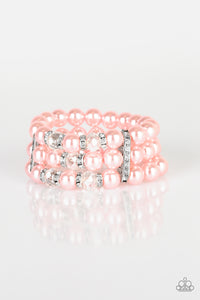 Paparazzi - Undeniably Dapper - Pink Bracelet - Pinched between white rhinestone encrusted frames, white rhinestone encrusted rings, crystal-beads, and pink pearls are threaded along elastic stretchy bands for a glamorous look.  Paparazzi Jewelry and accessories are lead-free and nickel-free.  Sold as one individual bracelet.