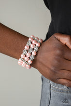 Load image into Gallery viewer, Paparazzi - Undeniably Dapper - Pink Bracelet - Pinched between white rhinestone encrusted frames, white rhinestone encrusted rings, crystal-beads, and pink pearls are threaded along elastic stretchy bands for a glamorous look.  Paparazzi Jewelry and accessories are lead-free and nickel-free.  Sold as one individual bracelet.
