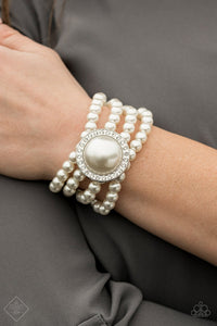 Pearl four tier bracelet with Pearl and Rhinestone  statement piece attached.   Sleek, classy, metallic designs that you’d find on the streets of New York.