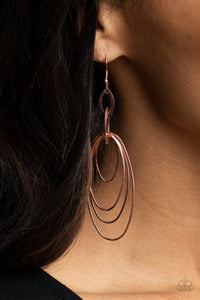 Increasing in size, shiny copper ovals ripple out from the bottom of interconnected flat shiny copper frames, creating a layered lure. Earring attaches to a standard fishhook fitting.